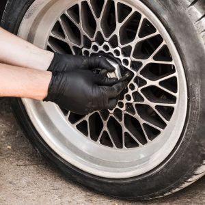 man swapping car wheel